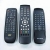 Three remote controls with silicone keypads placed on a white surface.